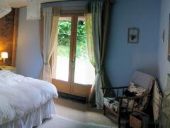 Chalet Ambroise - Bedroom 1, showing french windows to garden