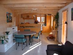 Chalet Les Buissons - The dining area, with kitchen beyond