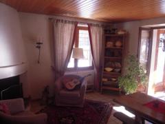 Chalet La Chapeline - The living area and fireplace