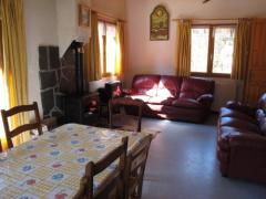 Chalet Le Chargeau - The living room with log burner