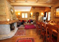 Chalet Chocolat - Granite fireplace and dining area
