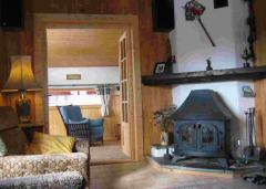 Chalet Les Chouettes - Log burner in the dining room