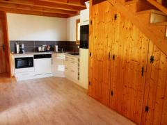 Chalet Étoile des Neiges - The kitchen and living area