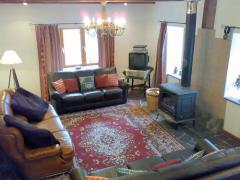 Ferme Leonard - The living room with log burner