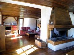 Ferme Sapin - The main living area and fireplace