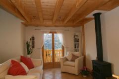 Chalet Geneviève - The living room with log burner