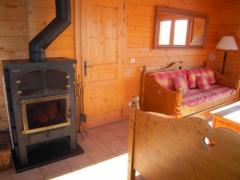 Chalet La Falaise - Log burner in the living rooom