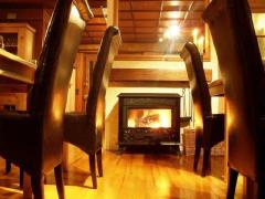 Chalet Les Pesses - The log burner in the dining room