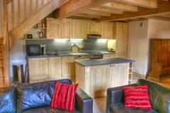 Penthouse Apartment - Open plan living area with fitted kitchen