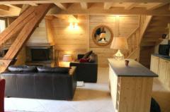 Penthouse Apartment - The sitting area with feature fireplace