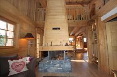 Chalet Le Perret - The living/TV room with fireplace