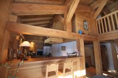Chalet Le Perret - The kitchen from the dining area