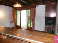 Chalet Soleret - Living room with fireplace and french windows